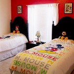Mickey Themed Room has 2 twin beds and an extra twin mattress for added flexibility